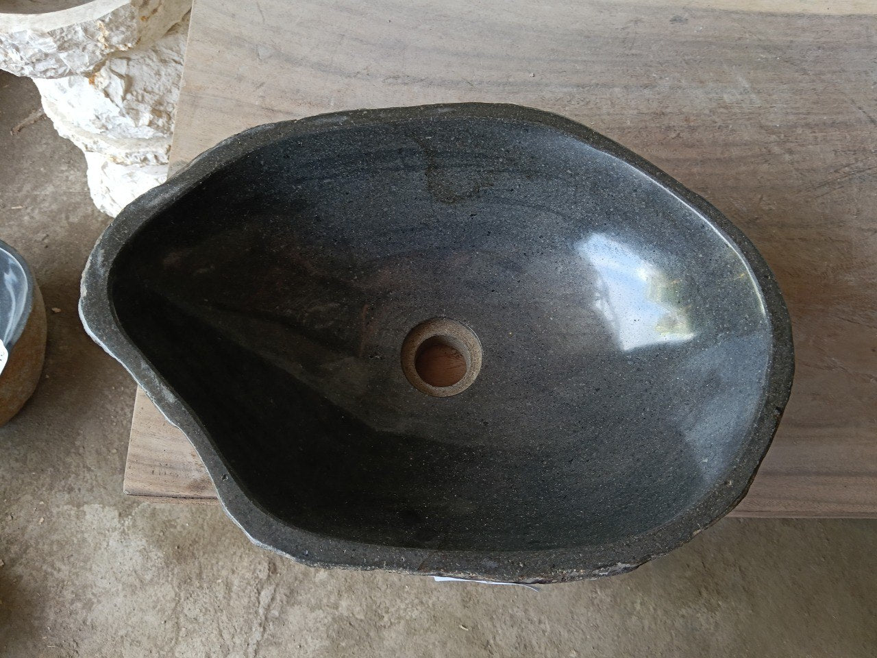 Top view of 6980-4632 river stone sink with polished dark graphite interior
