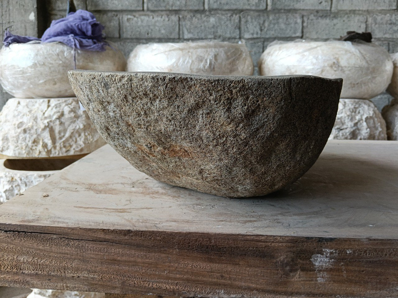 Left side of 6981-4532 river stone sink in sand-brown natural rock
