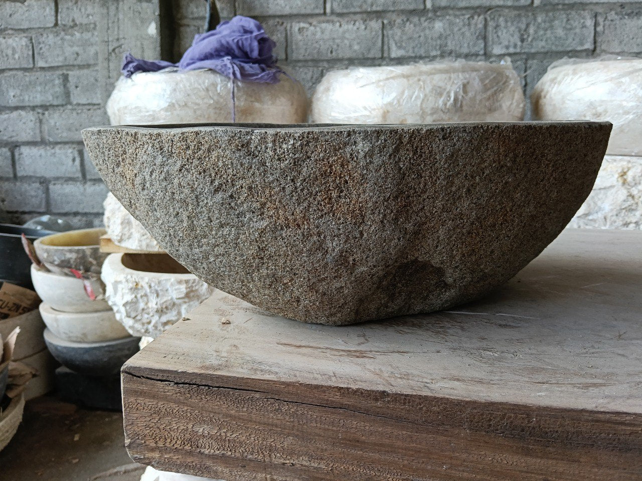 Front view of 6981-4532 natural river rock vessel sink, light brown exterior
