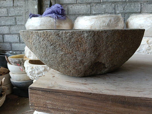 Front view of 6981-4532 natural river rock vessel sink, light brown exterior
