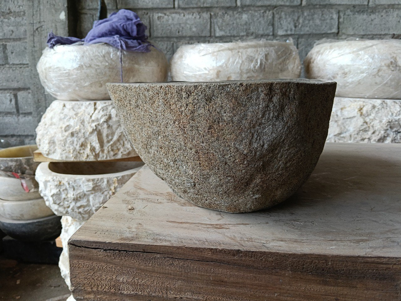 Right side of 6981-4532 natural stone vessel sink, polished bowl and raw exterior
