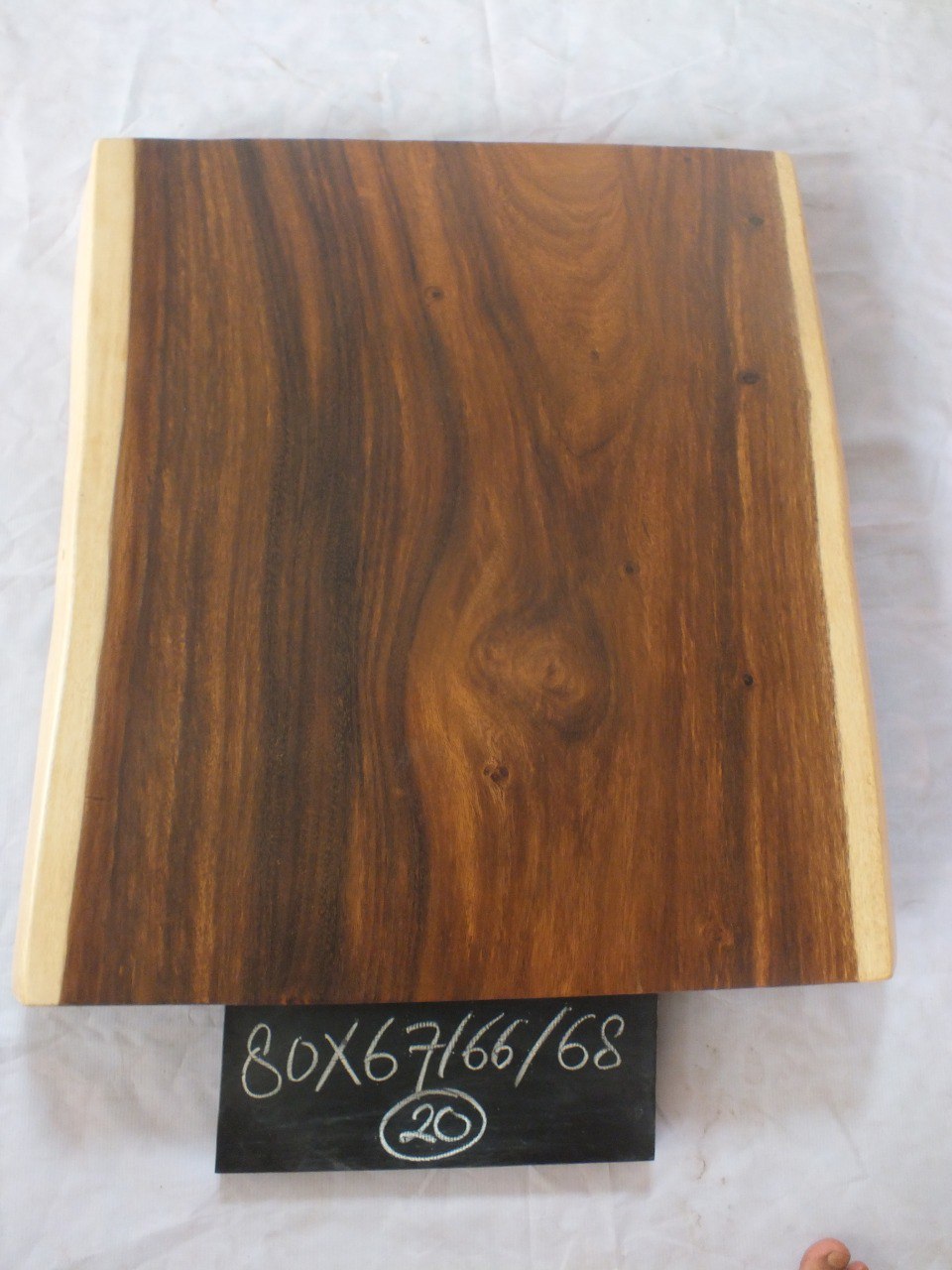 Top view of suar wood slab 0020-676668 with wide live edge shape and rich brown natural wood grain, solid single-piece countertop.
