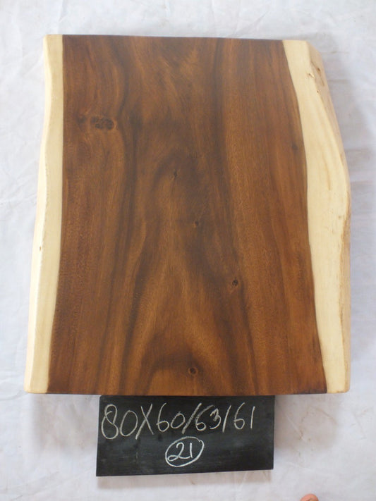 Top view of suar wood slab 0021-606361 with live edge shape and warm brown natural wood grain, solid single-piece countertop.
