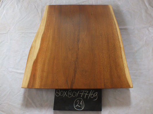 Top view of suar wood slab 0024-807769 with extra-wide live edge shape and rich brown natural wood grain, solid single-piece countertop.
