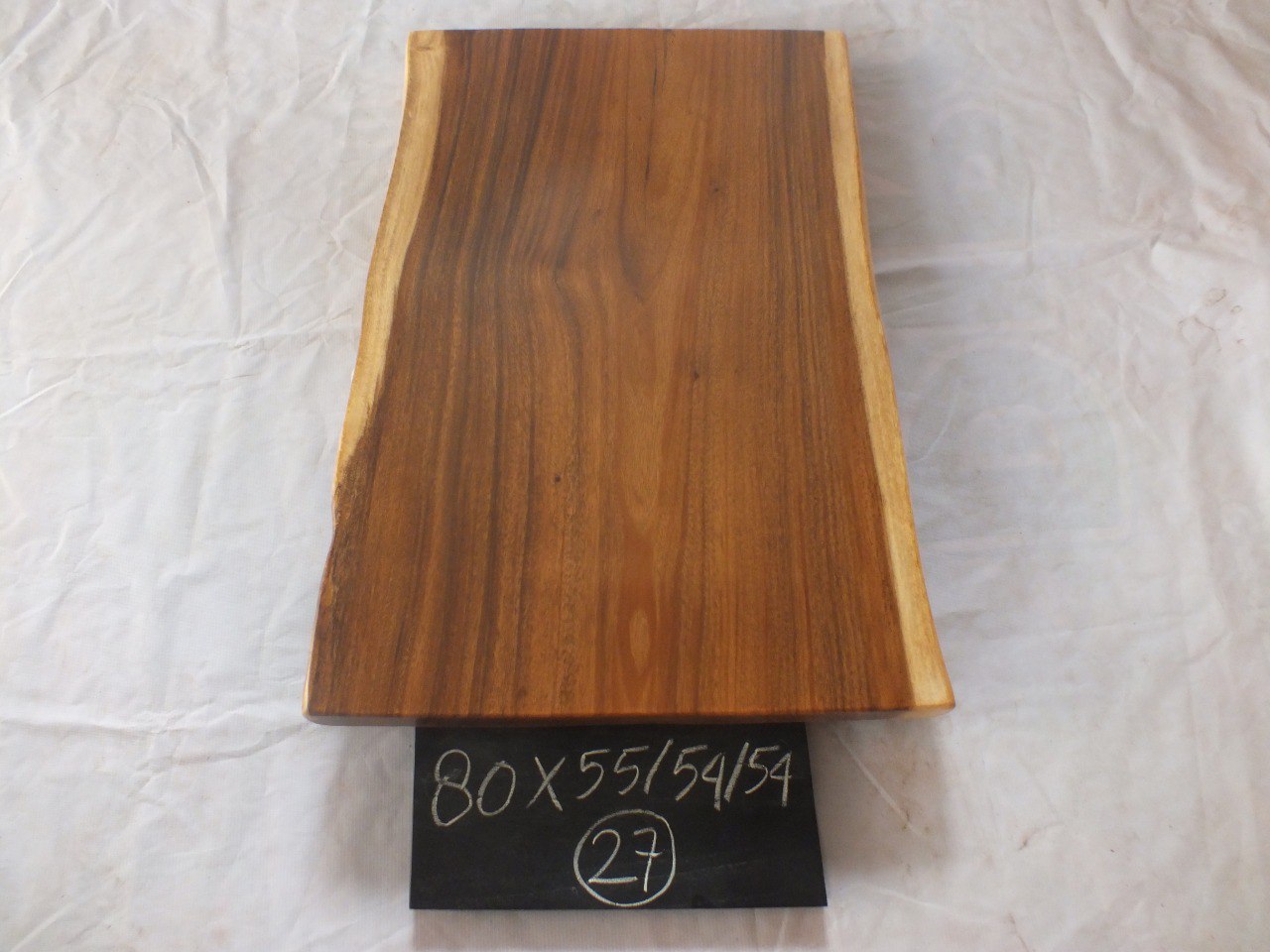 Top view of suar wood slab 0027-555454 with natural live edges and warm brown solid wood grain, single-piece hardwood countertop.
