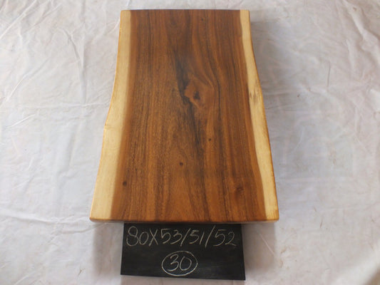 Top view of suar wood slab 0030-535152 with natural live edges and warm brown solid wood grain, single-piece hardwood countertop.
