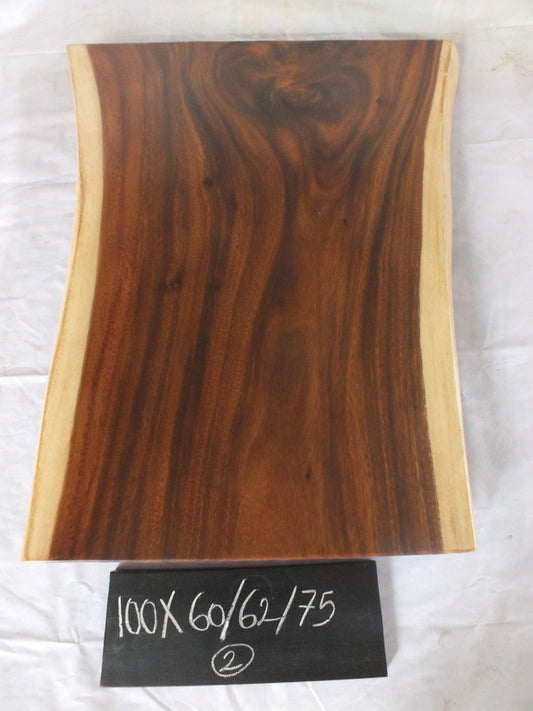 Top view of suar wood slab 0002-606275 with strong widening live edge shape and rich brown natural wood grain, solid single-piece countertop.
