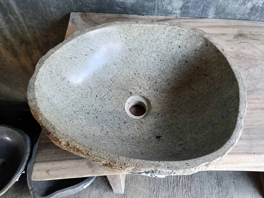 Close-up view of river stone sink 6536-1815 showcasing textured exterior surface.
