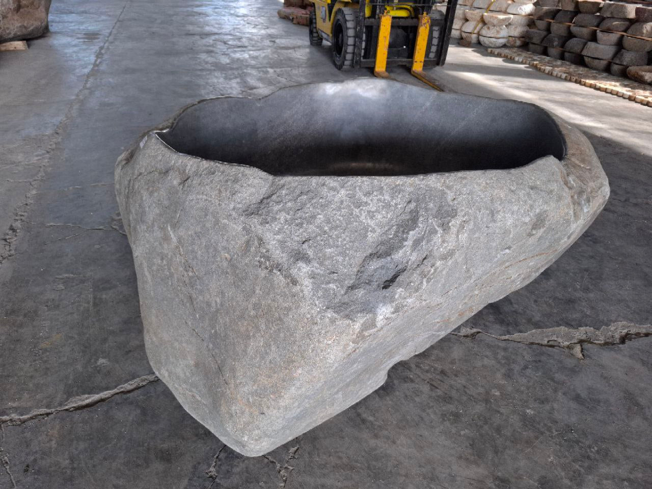 Luxury spa bathtub handcrafted from solid river stone
