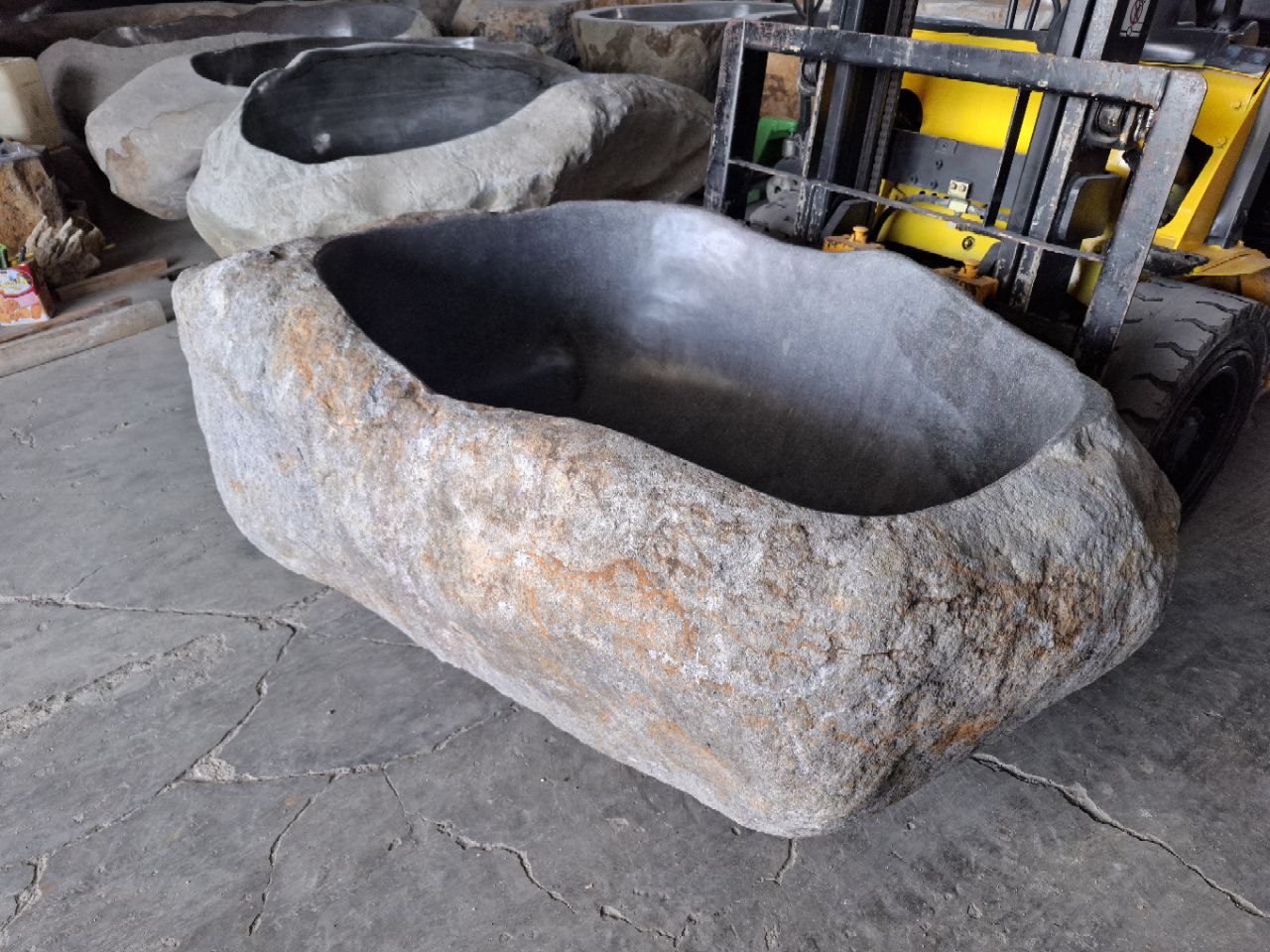 Luxury spa bathtub with natural stone texture
