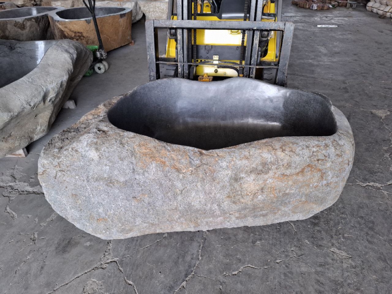 Top view of freestanding river stone bathtub
