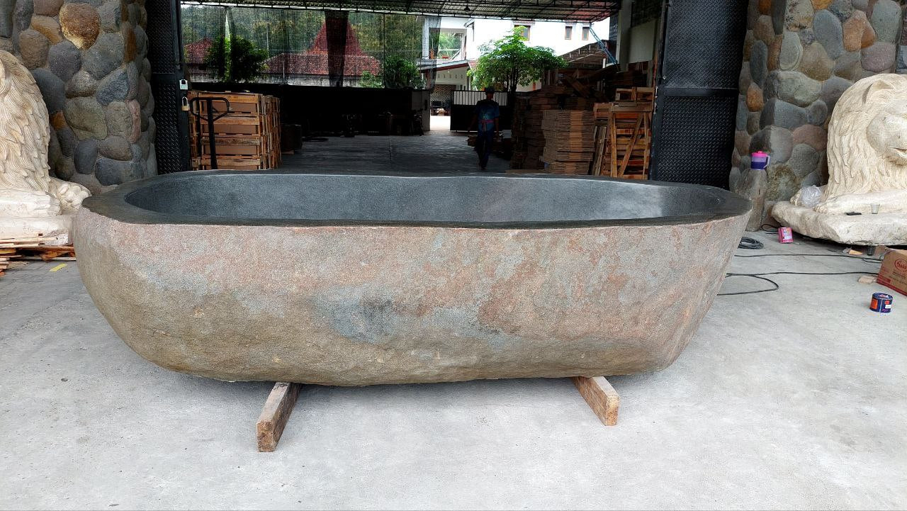 Organic shape river stone bathtub with unique natural exterior
