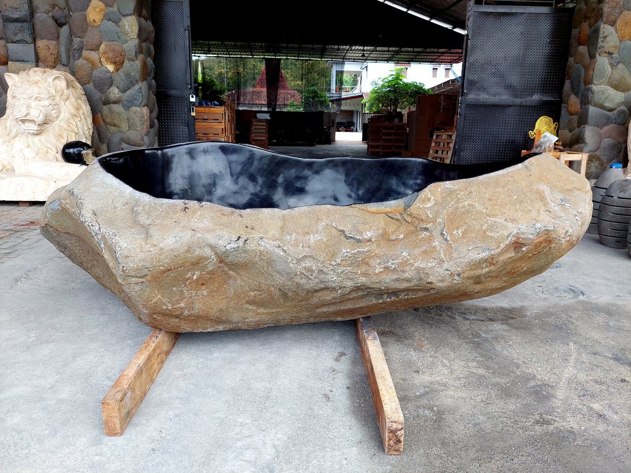 River stone bathtub front view – handcrafted natural stone tub