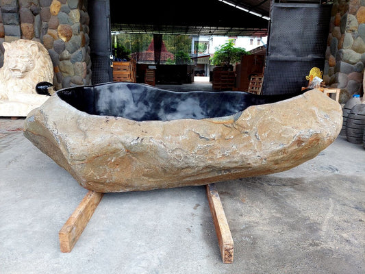 River stone bathtub front view – handcrafted natural stone tub