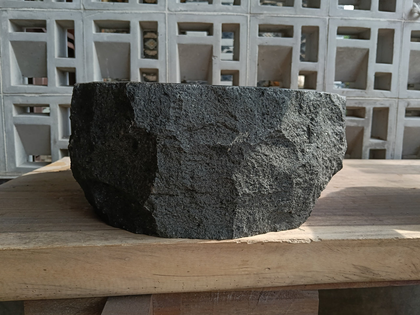 Left side of 60A7-4238 handcrafted dark gray andesite stone basin
