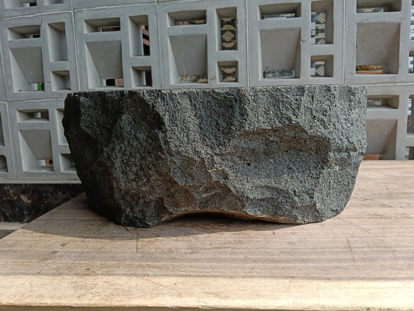 Back view of 60A7-4238 volcanic andesite stone sink — textured natural exterior
