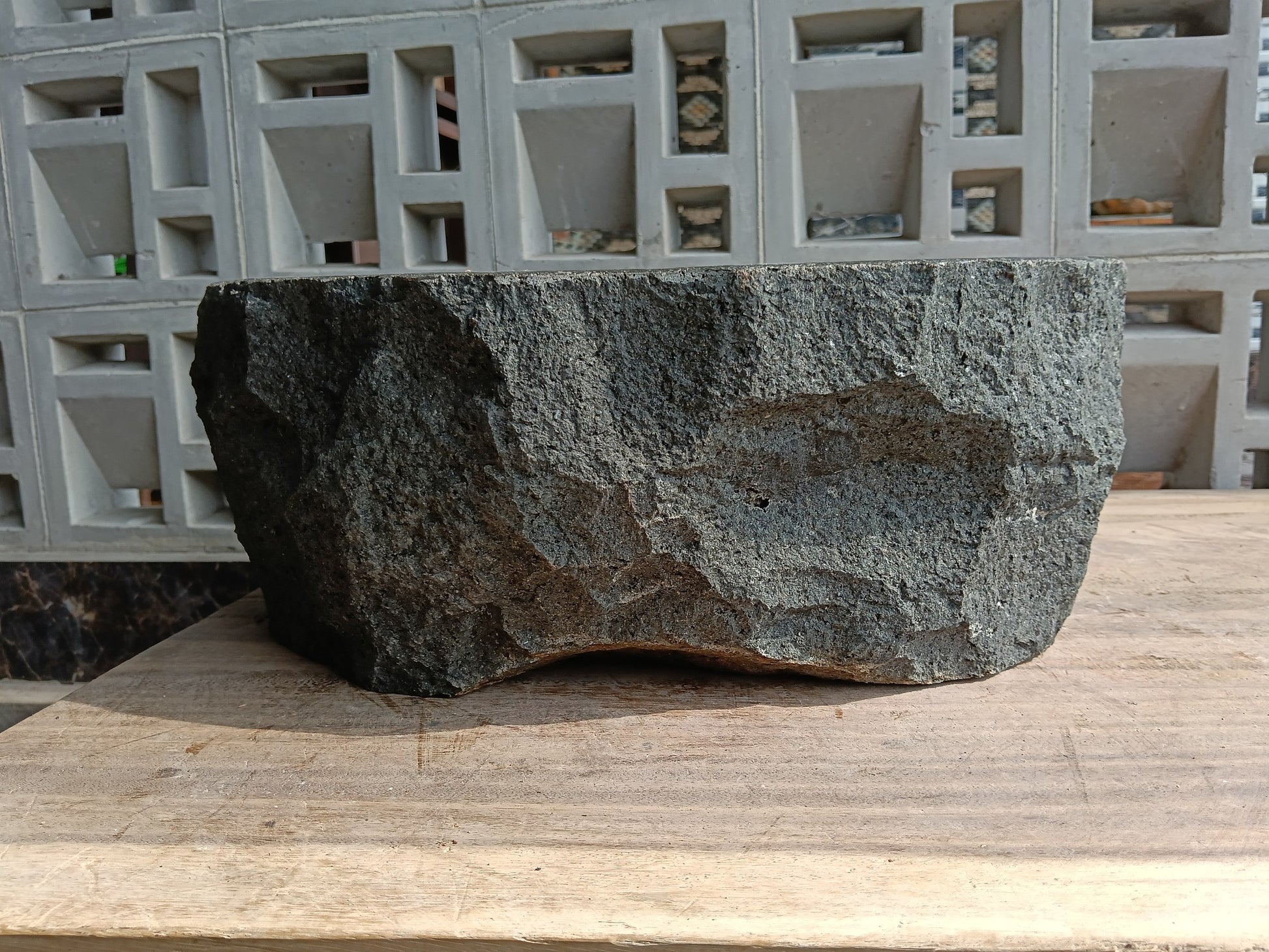 Back view of 60A7-4238 volcanic andesite stone sink — textured natural exterior
