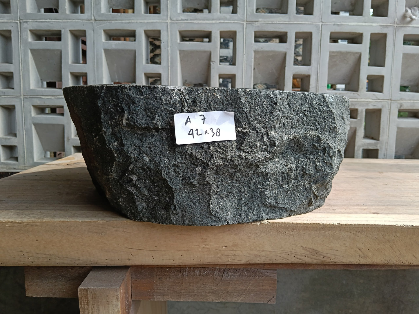 Front view of 60A7-4238 andesite vessel basin — polished oval interior
