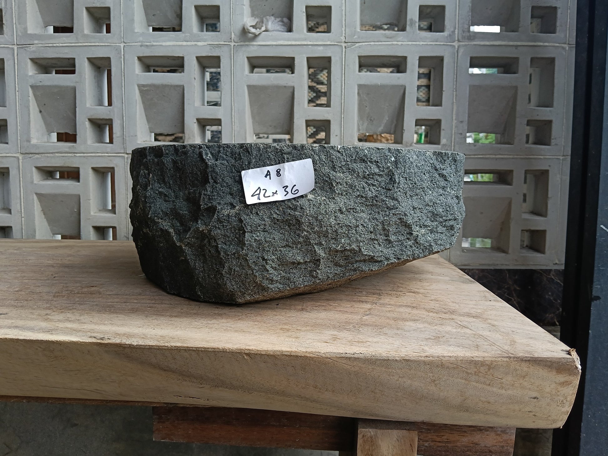 Front view of 60A8-4236 andesite vessel basin — polished interior and natural edge
