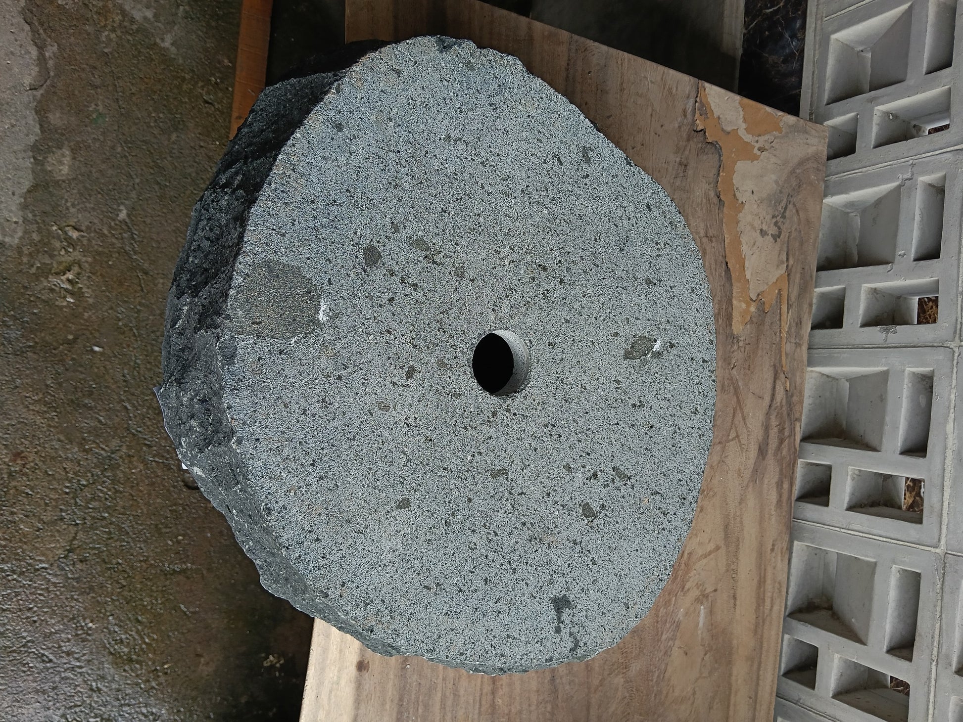 Bottom view of 60A9-5040 solid andesite stone sink — standard drain hole
