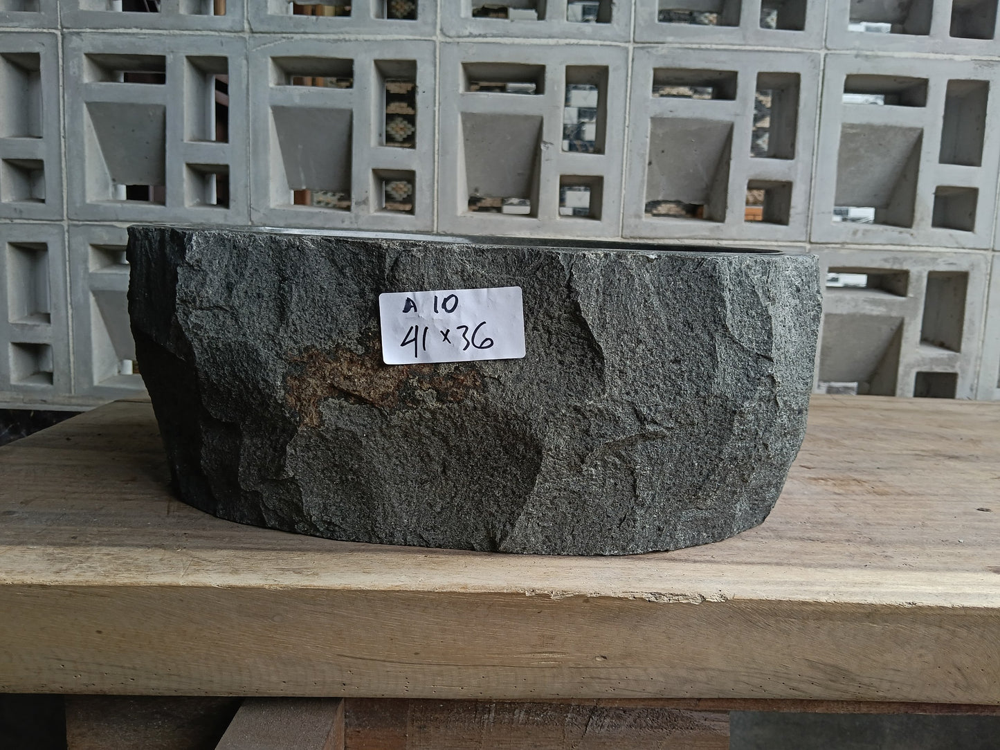 Front view of 6A10-4136 andesite vessel basin — polished oval interior
