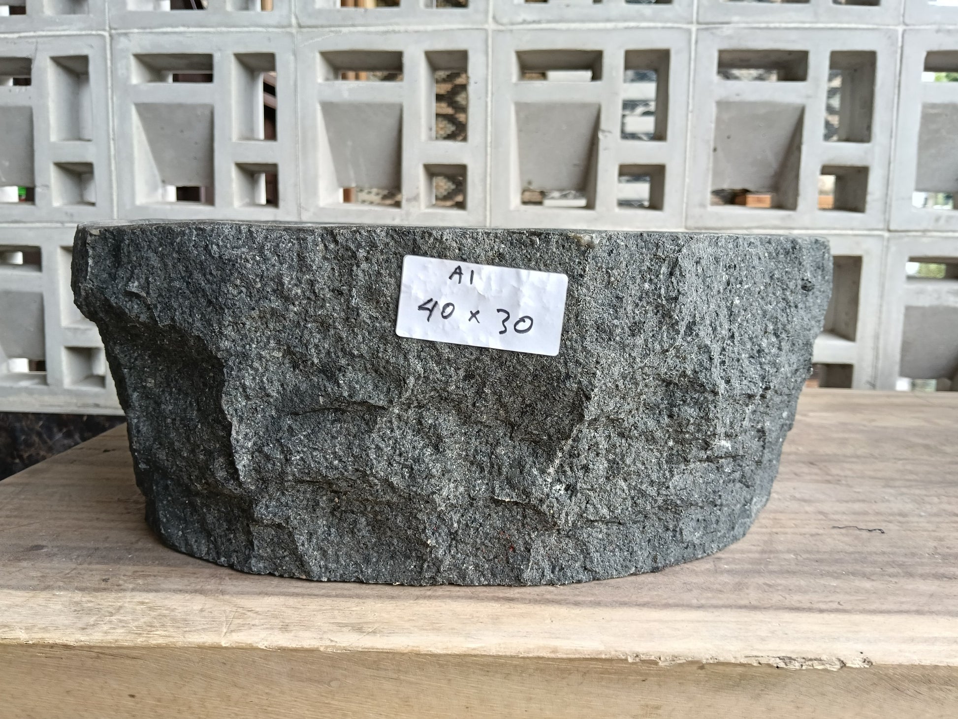 Front view of 60A1-4030 andesite stone basin — polished interior and natural edge
