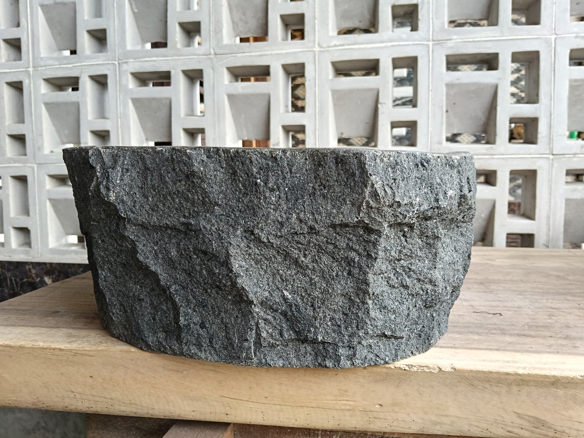 Right side of 60A1-4030 organic andesite stone basin — smooth interior
