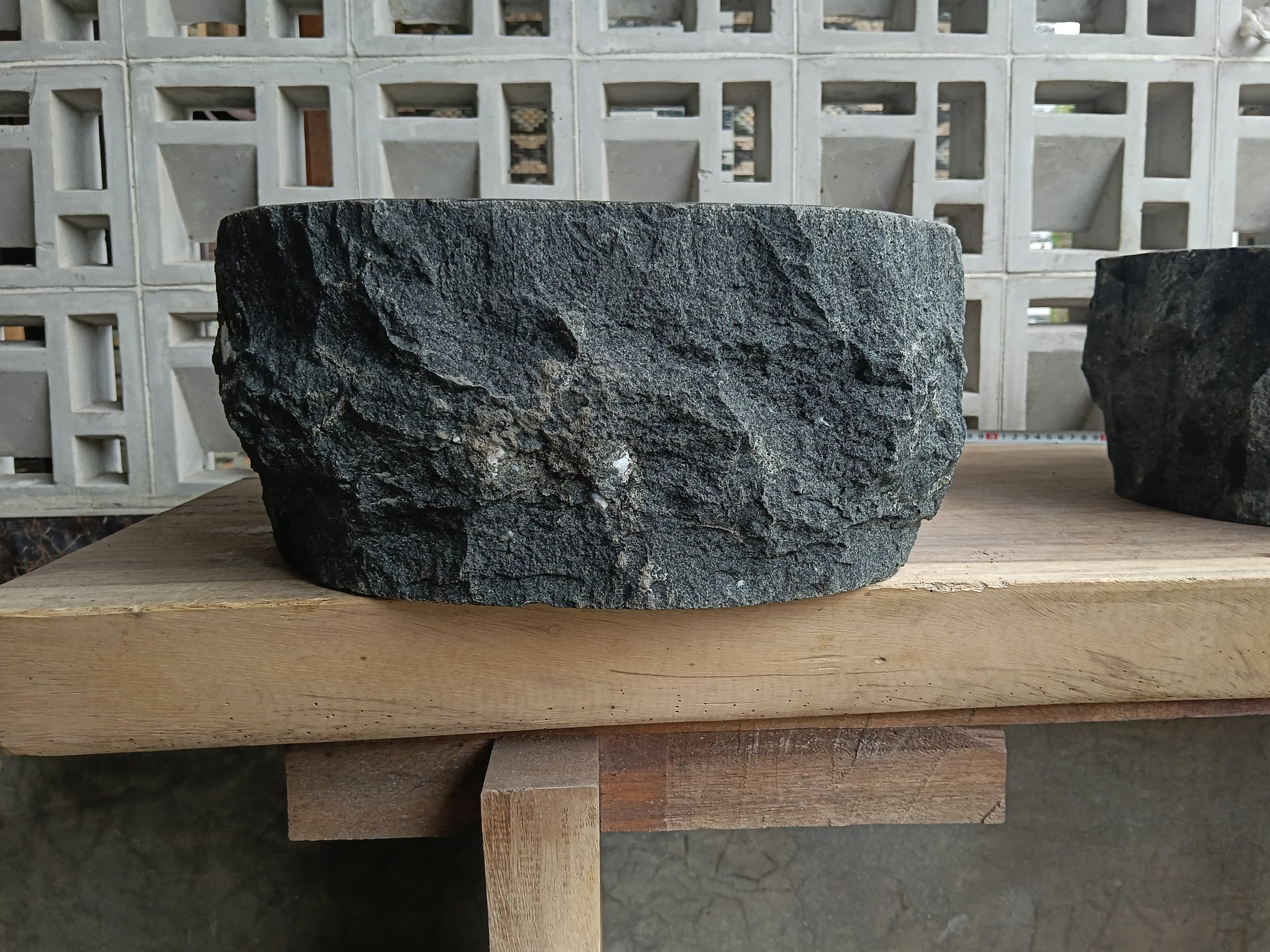 Left side of 6A12-4236 handcrafted dark gray andesite stone basin
