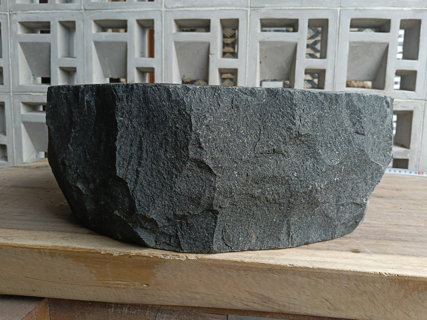 Back view of 6A13-4138 volcanic andesite stone sink — textured exterior surface
