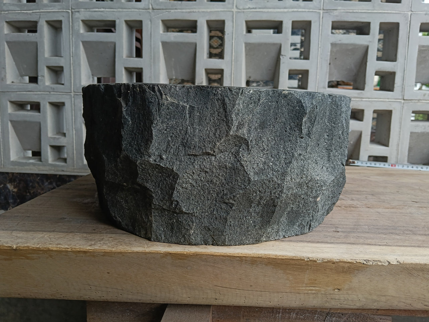 Left side of 6A13-4138 handcrafted dark gray andesite stone basin
