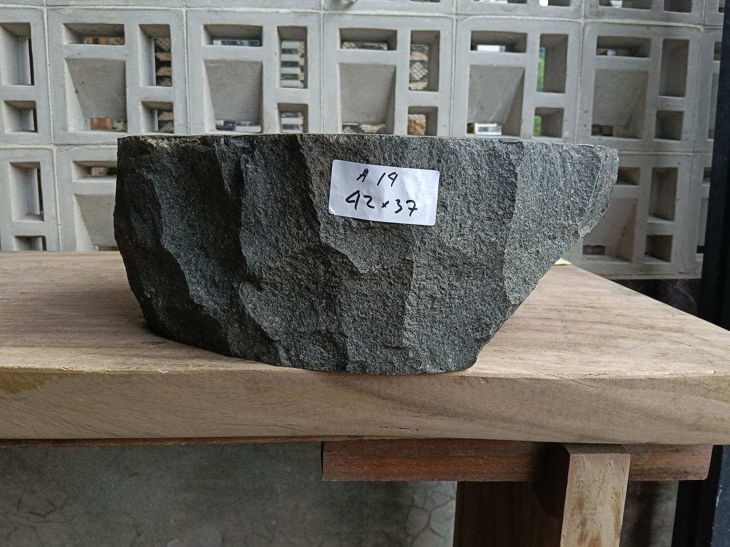 Front view of 6A14-4237 andesite vessel basin — polished interior and natural edge
