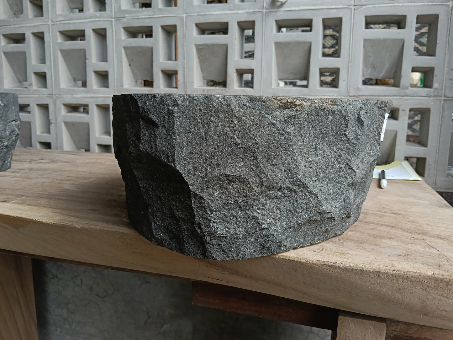 Left side of 6A14-4237 handcrafted dark gray andesite stone basin

