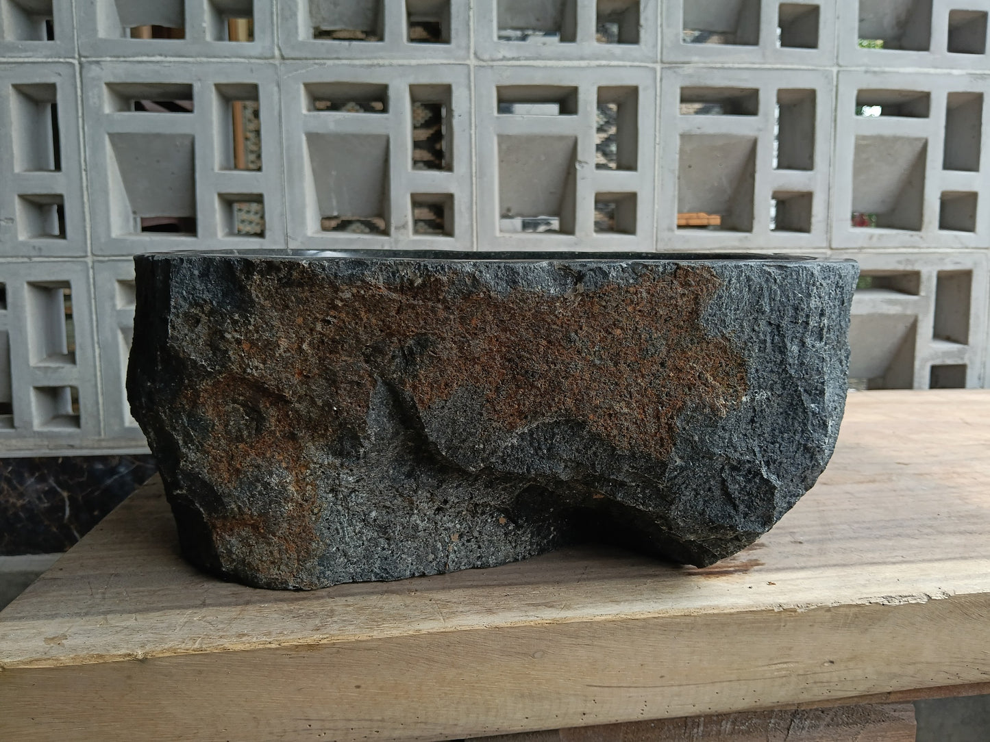 Back view of 6A15-3734 natural andesite basin — textured exterior surface

