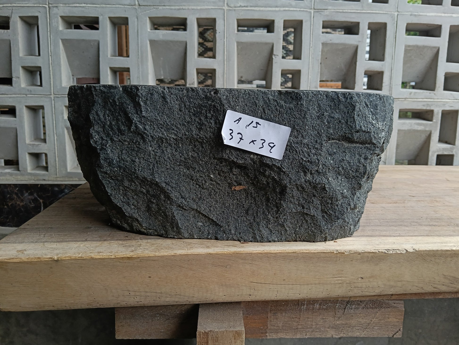 Front view of 6A15-3734 andesite stone vessel — polished interior bowl
