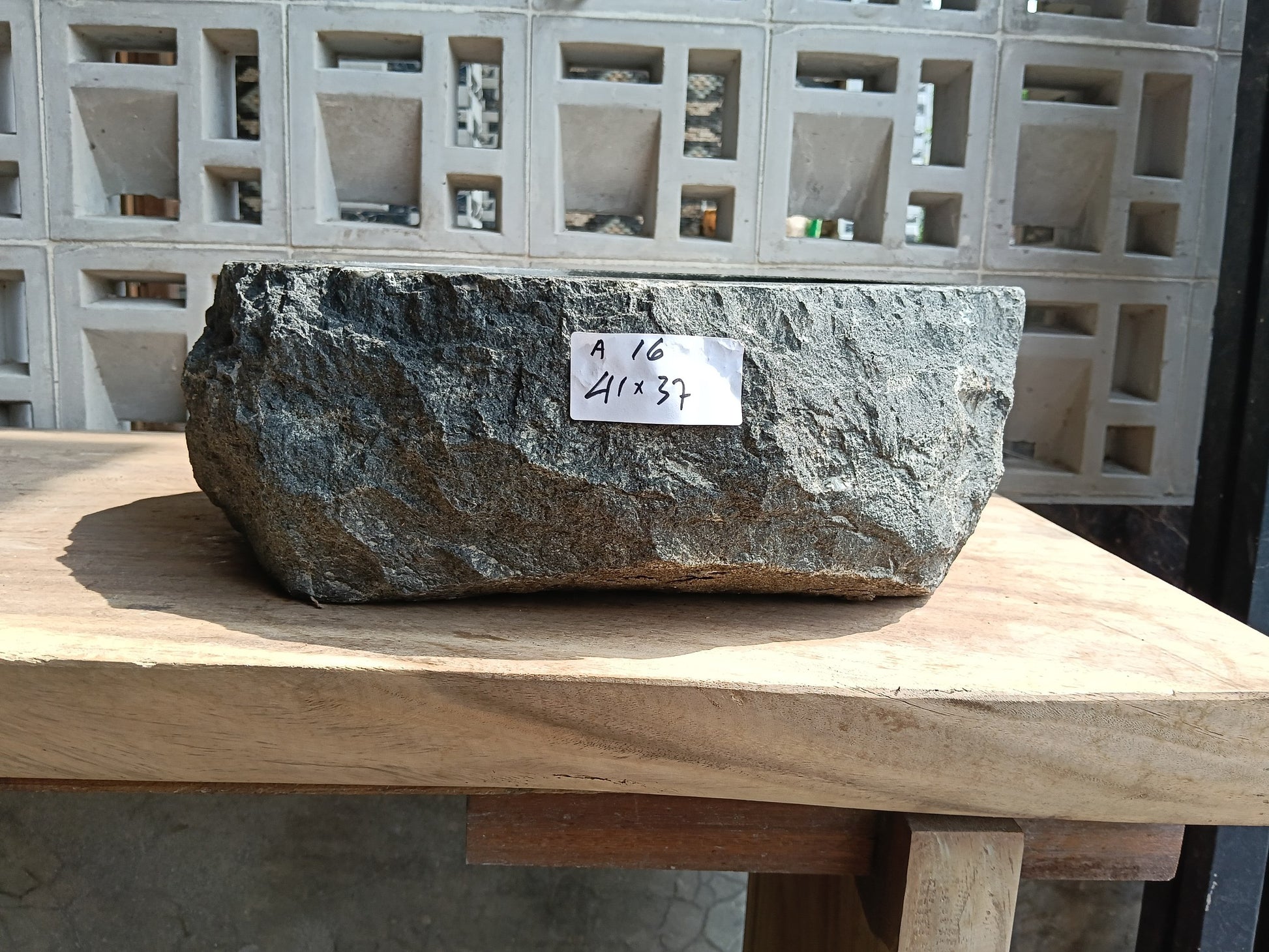 Front view of 6A16-4137 andesite vessel basin — polished oval interior
