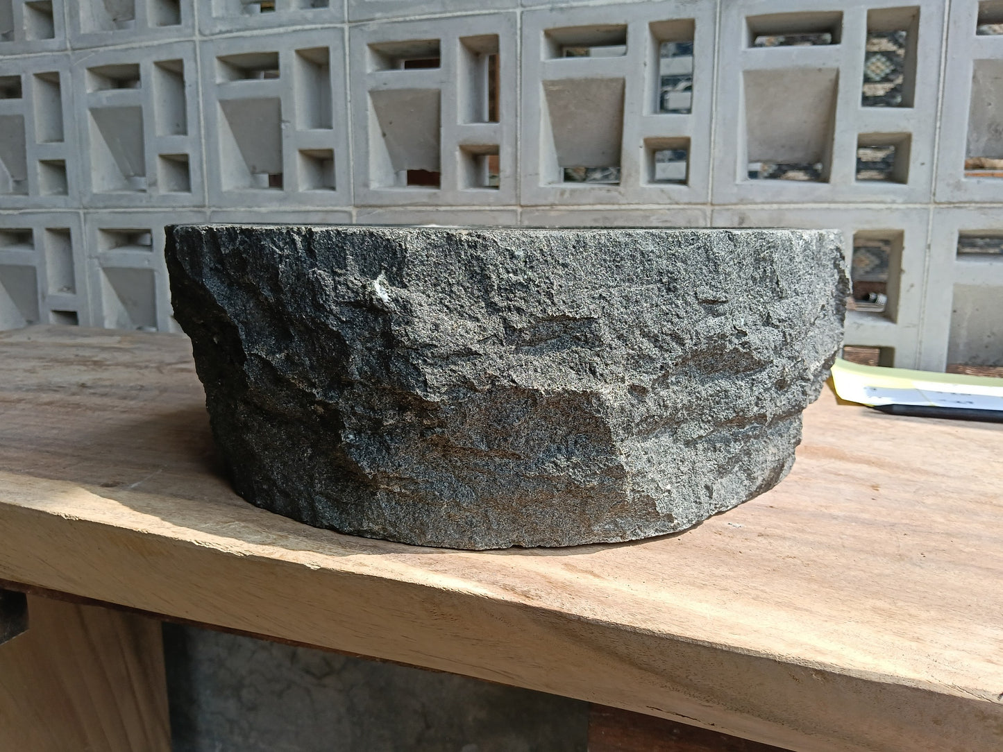 Left side of 6A16-4137 handcrafted dark gray andesite stone basin
