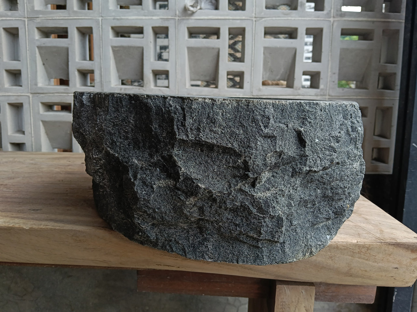 Left side of 6A17-4238 organic triangular andesite stone sink
