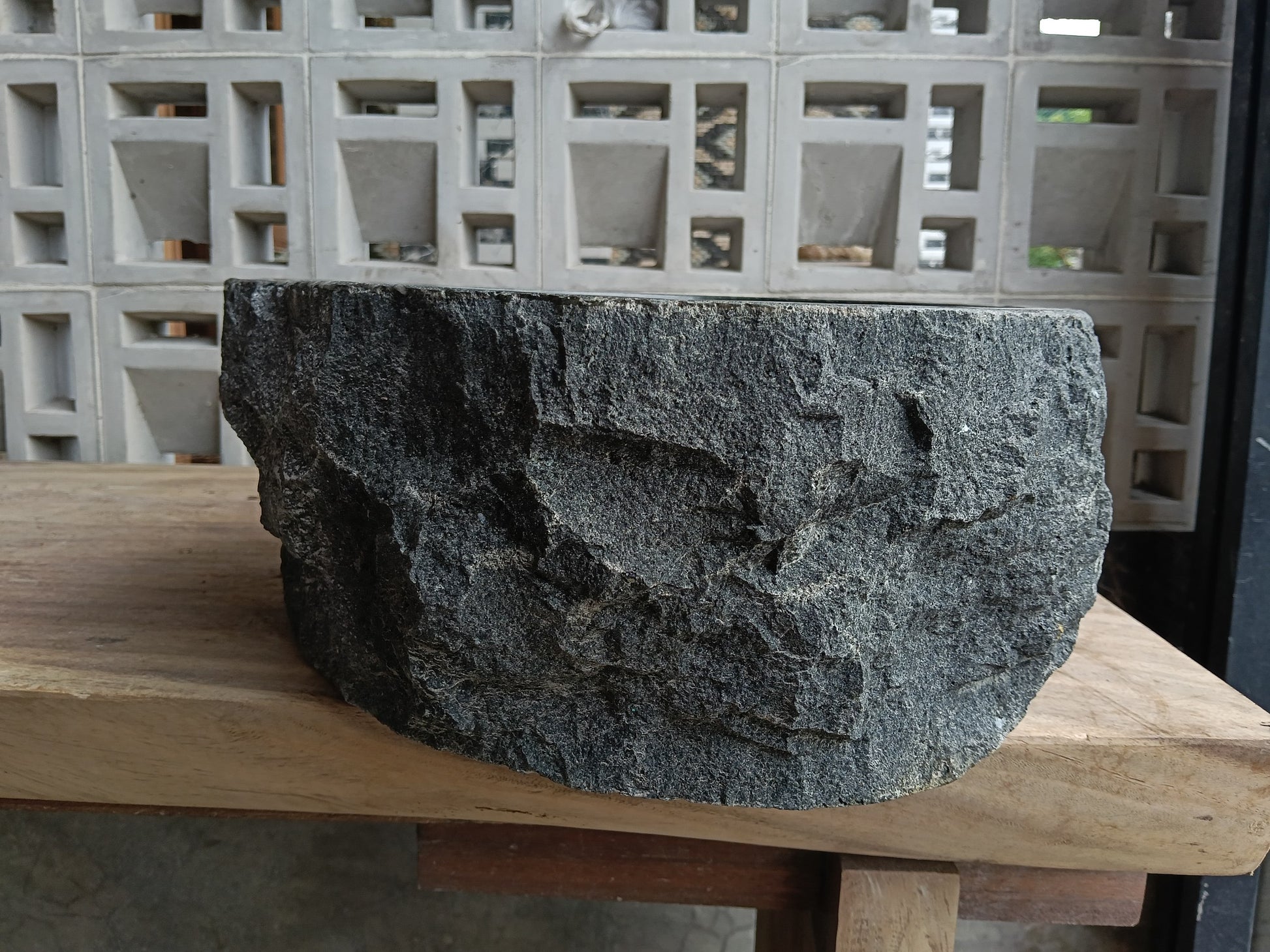 Left side of 6A17-4238 organic triangular andesite stone sink
