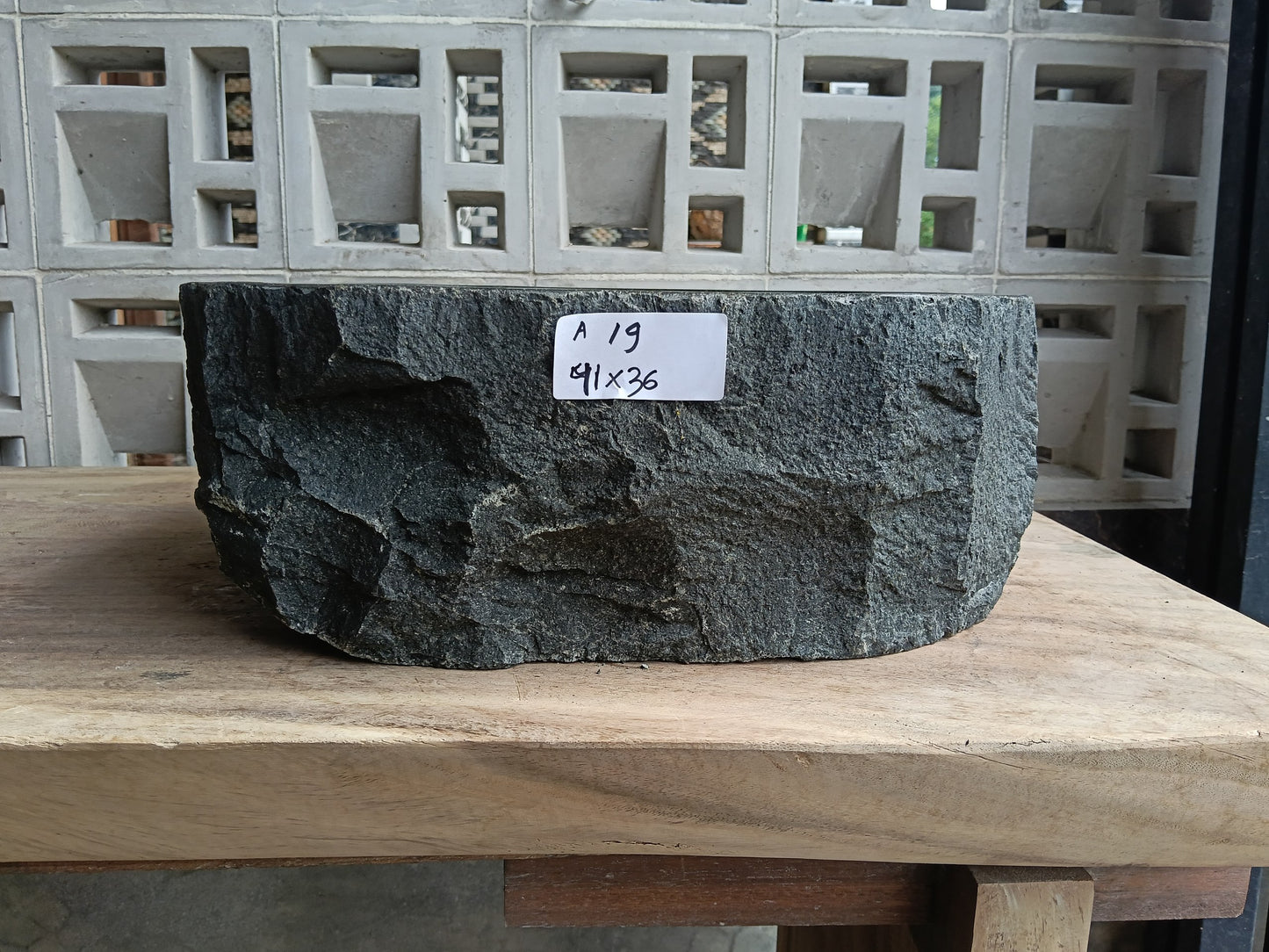 Front view of 6A19-4136 andesite stone vessel — polished interior bowl
