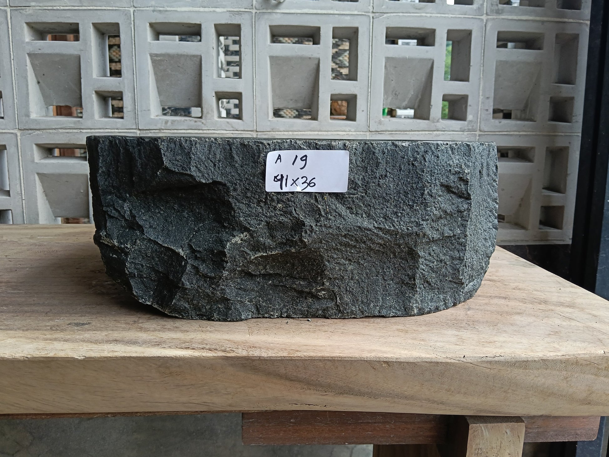 Front view of 6A19-4136 andesite stone vessel — polished interior bowl

