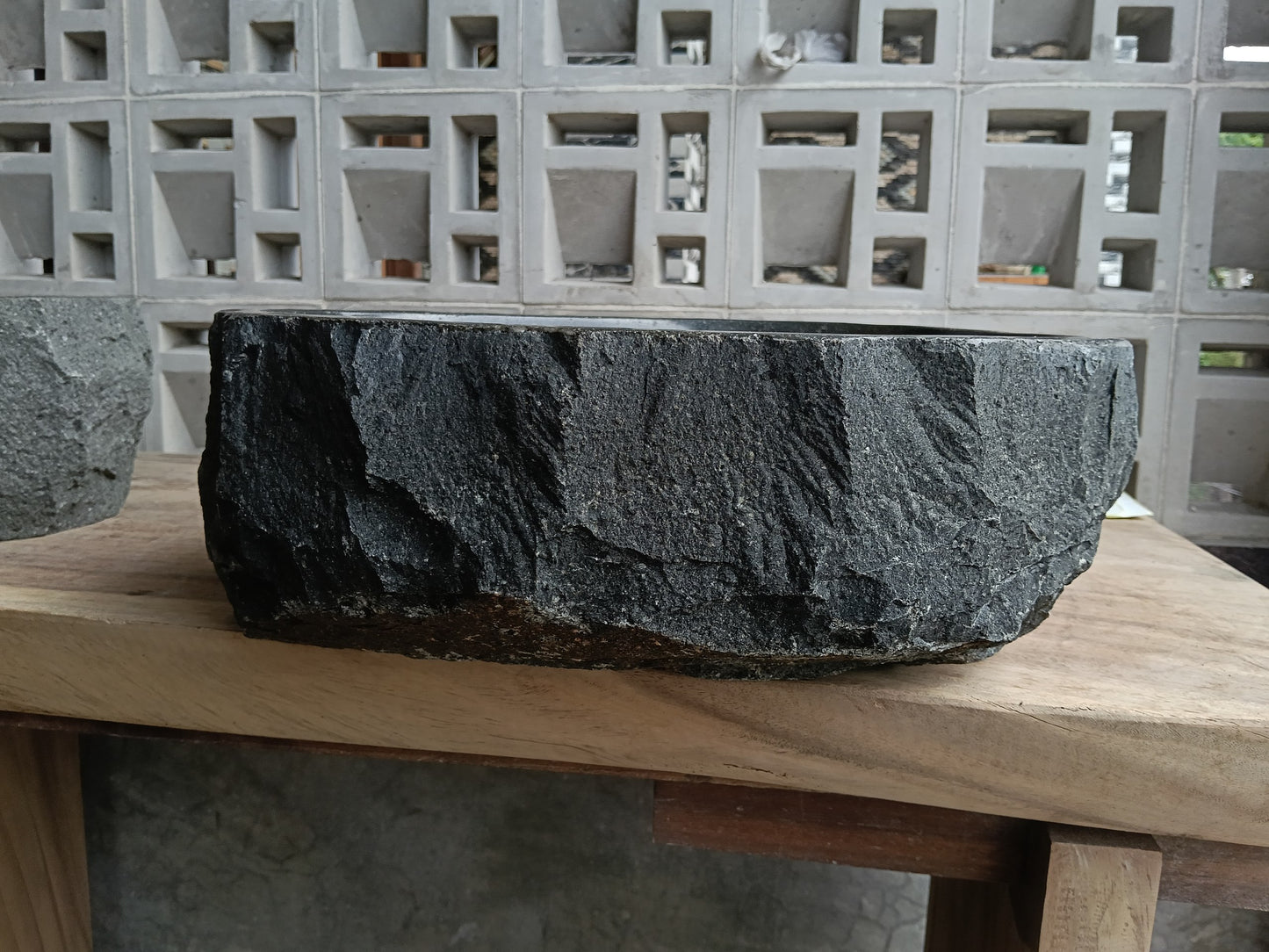 Back view of 6A19-4136 natural andesite basin — textured exterior surface
