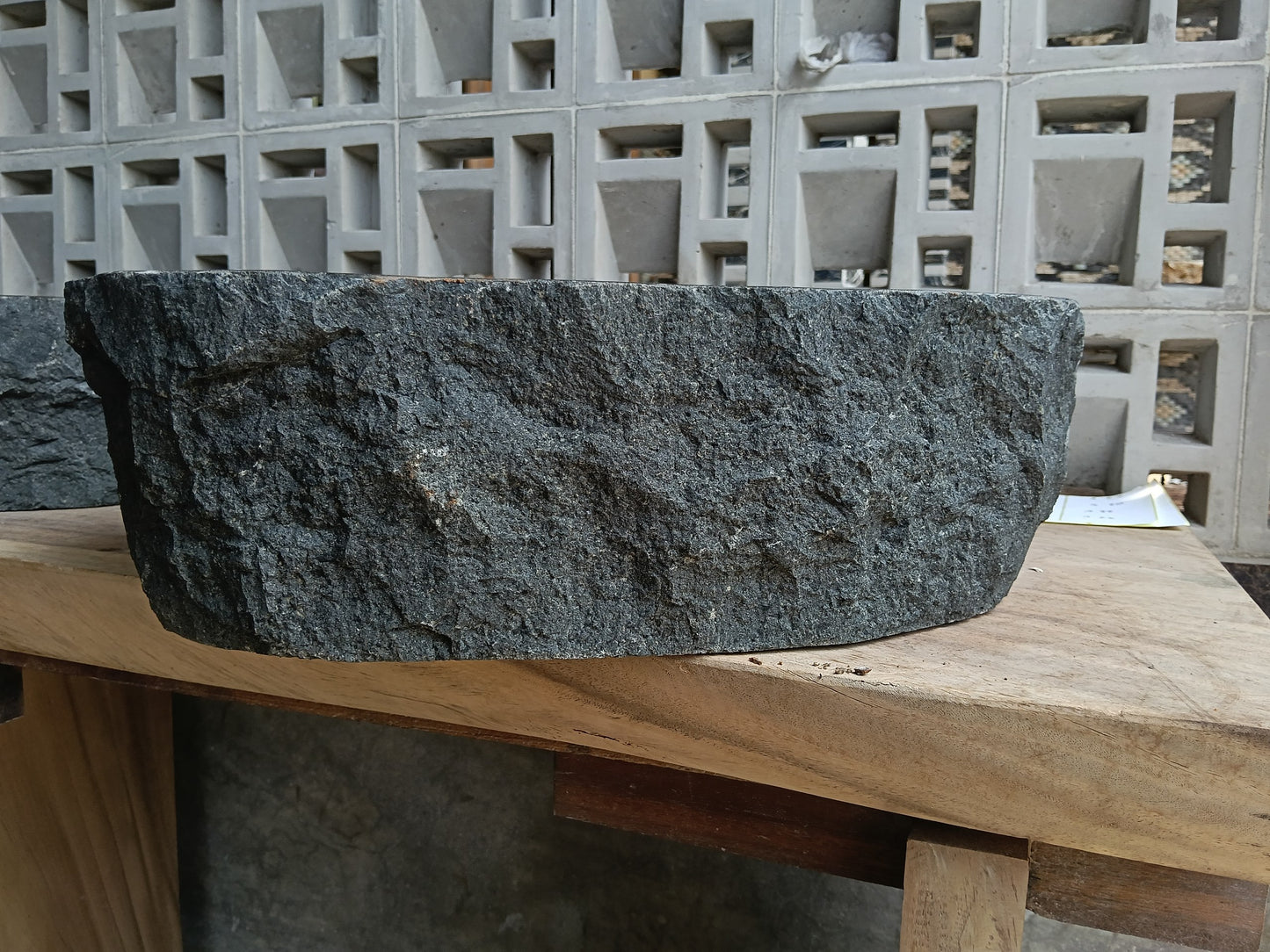 Back view of 6A21-5238 natural andesite basin — textured exterior surface
