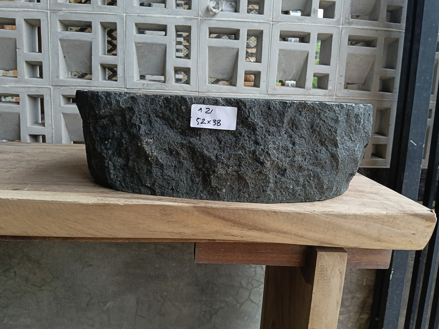 Front view of 6A21-5238 andesite stone vessel — polished interior bowl

