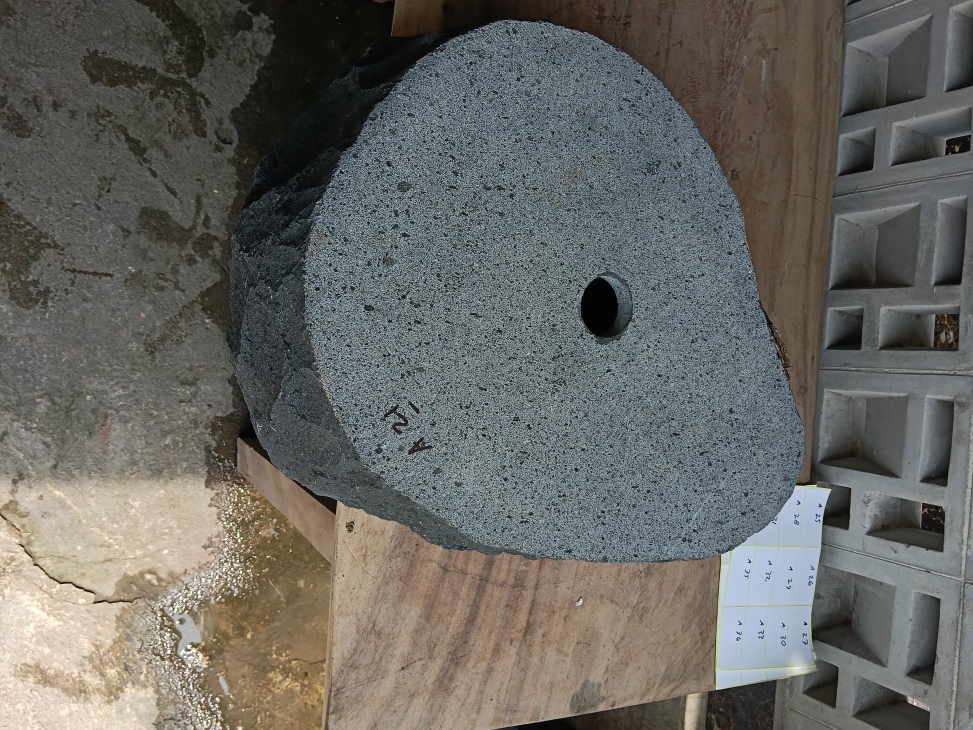 Bottom view of 6A21-5238 solid andesite stone sink — standard drain hole
