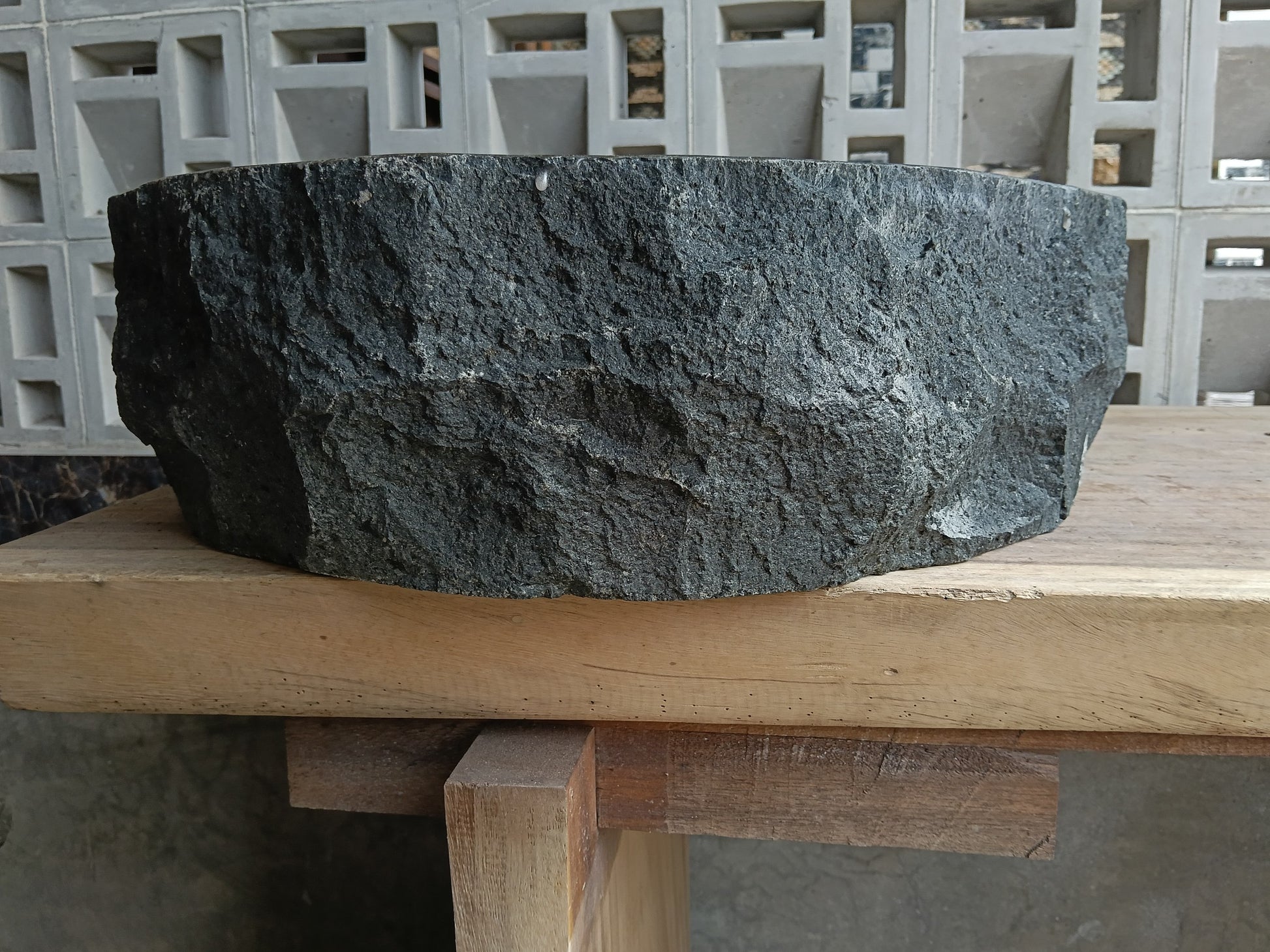 Back view of 6A22-5043 natural andesite basin — textured exterior surface
