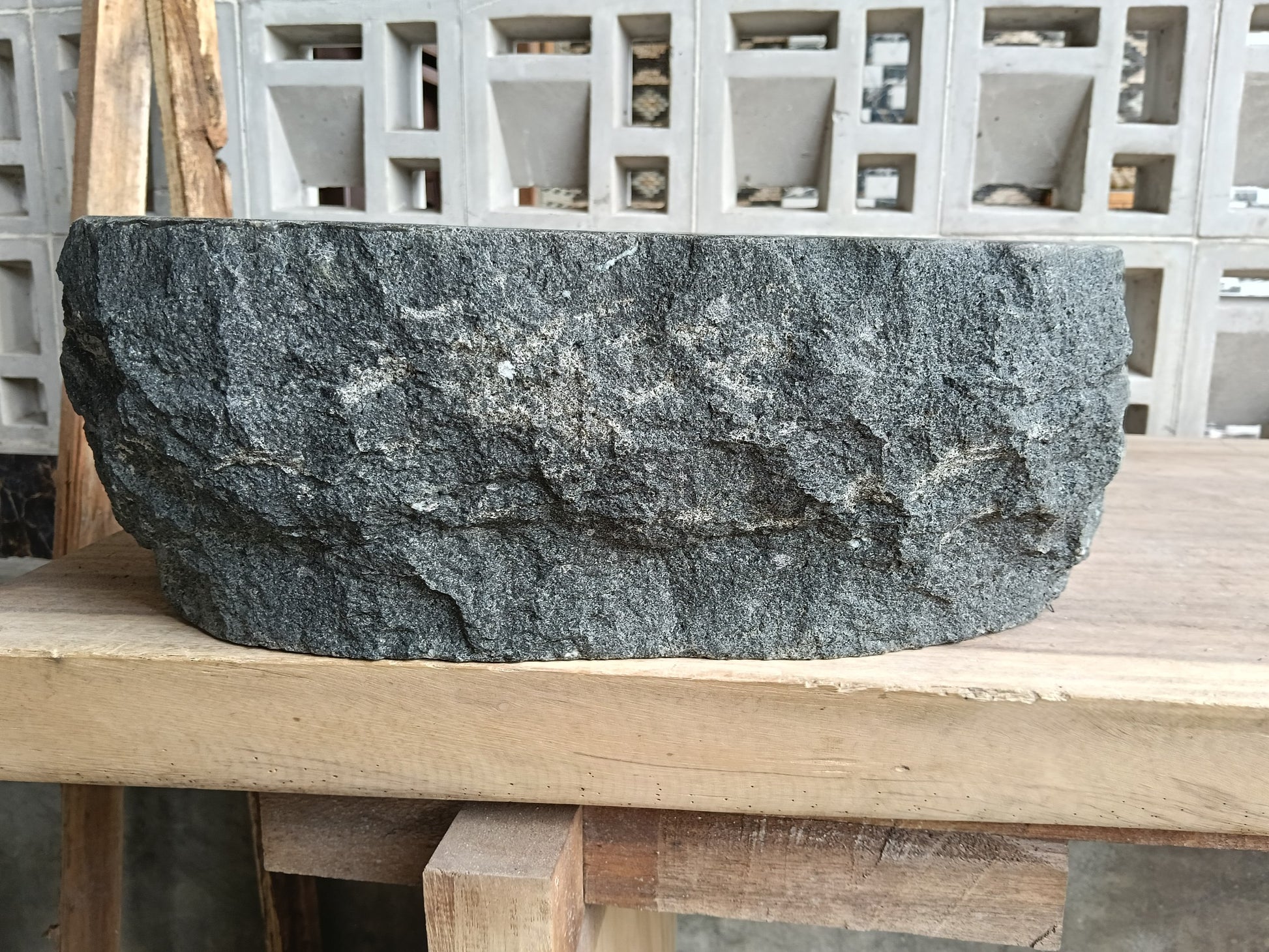 Back view of 60A3-4237 volcanic andesite stone sink — raw textured exterior

