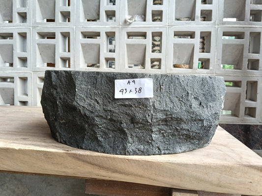 Front view of 60A4-4338 andesite stone basin — polished interior and raw edge
