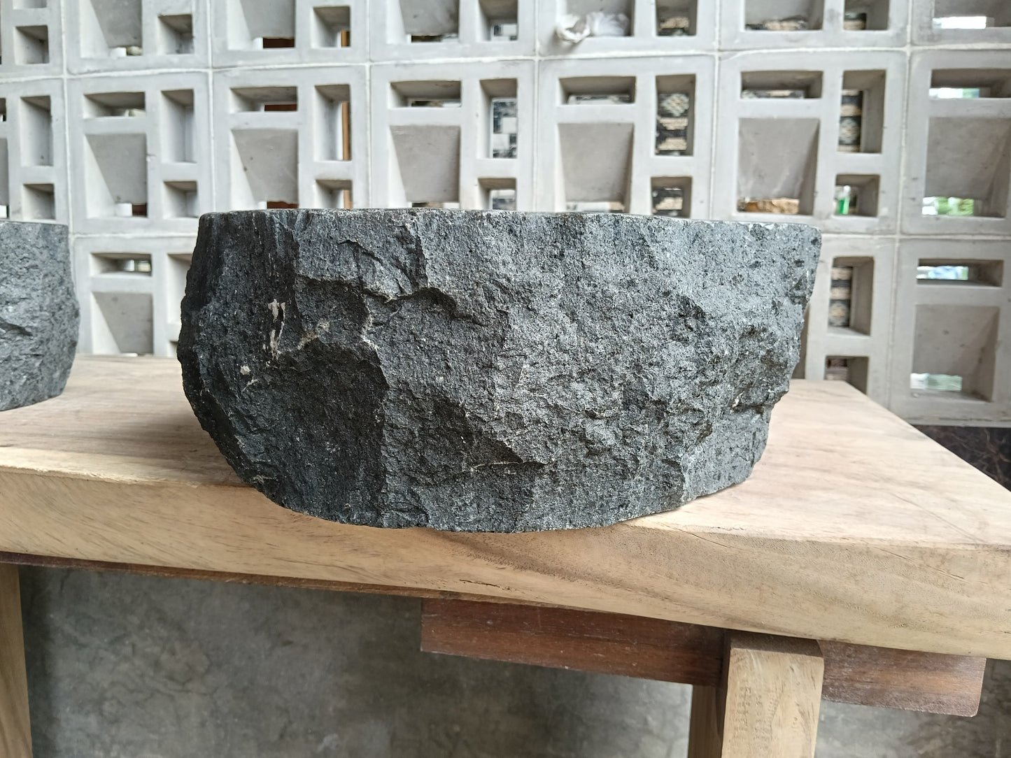 Left side of 60A4-4338 handcrafted dark gray andesite stone basin
