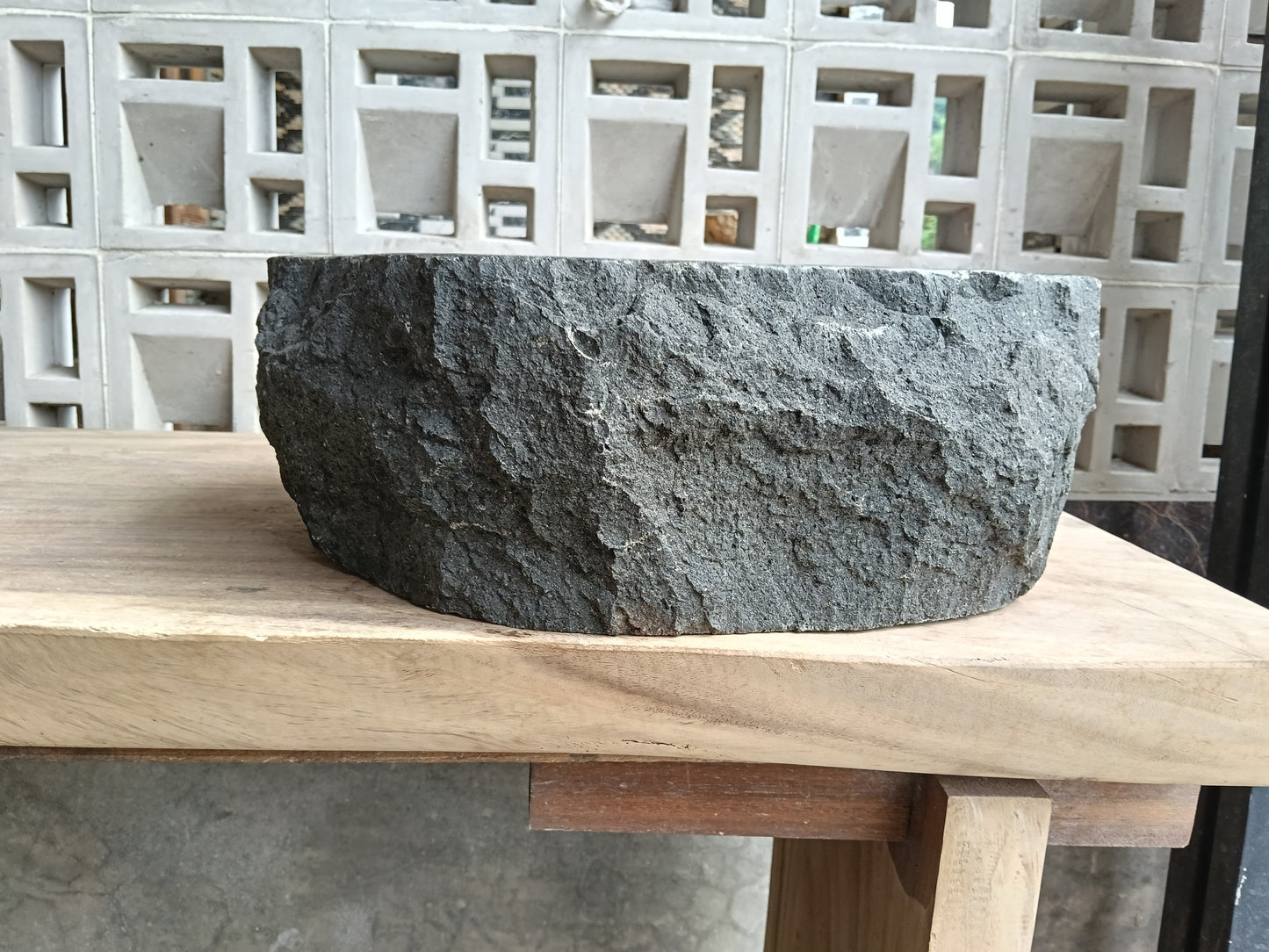 Back view of 60A4-4338 volcanic andesite vessel sink — natural textured exterior
