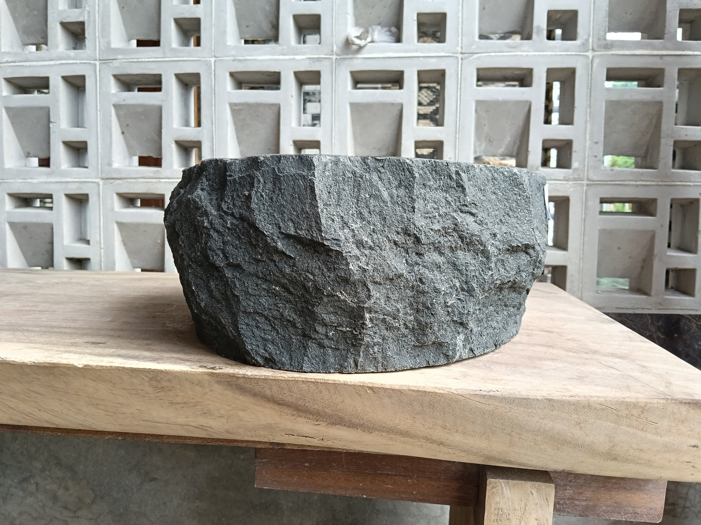 Right side of 60A4-4338 organic oval andesite stone sink — smooth interior
